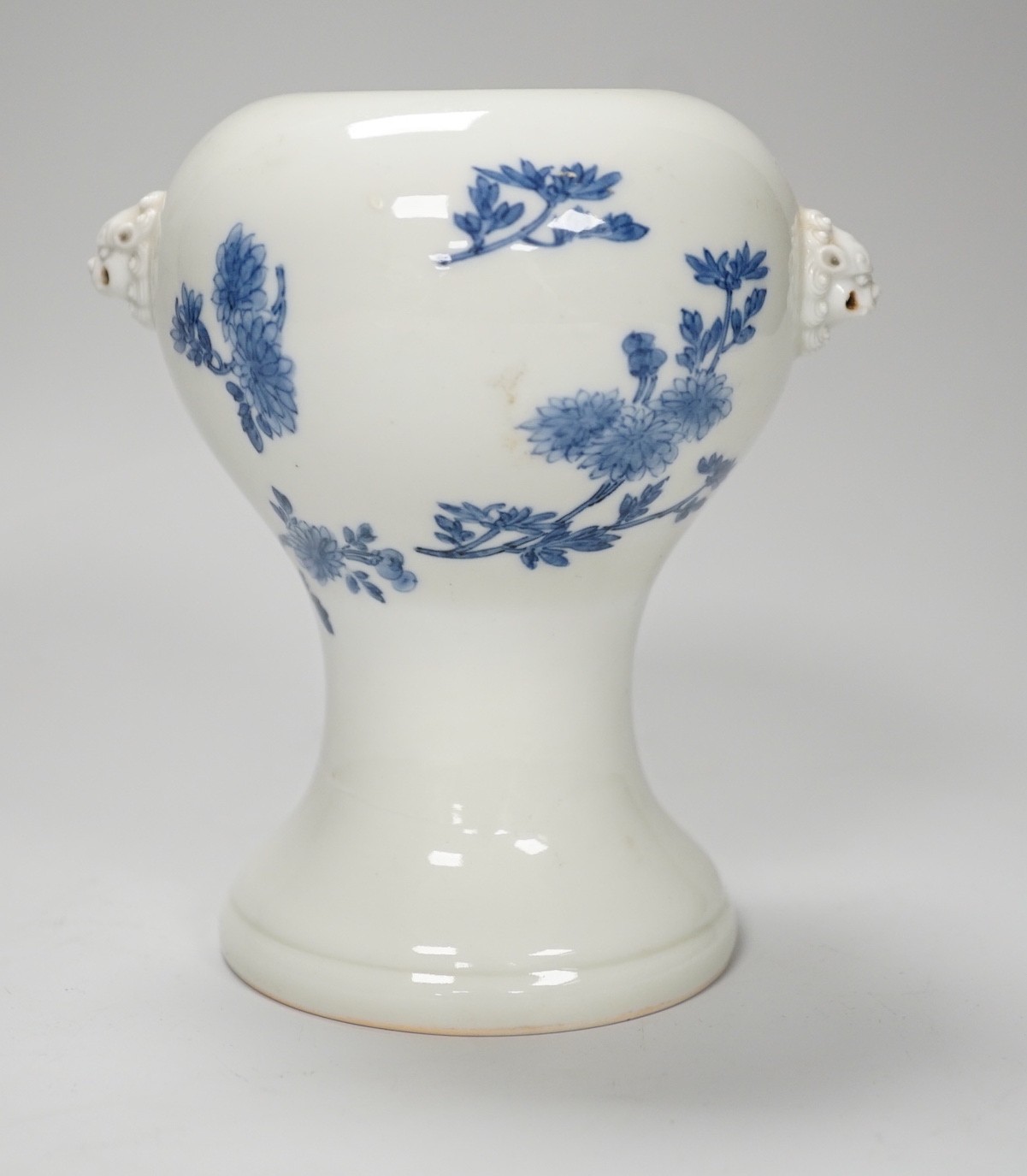 A Japanese blue and white vase, Meiji period, possibly Hirado, with lion mask handles. 13cm high